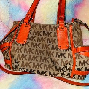 Michael Kors orange and tan original large purse it was worn 5x’s.
